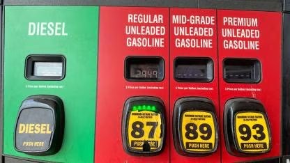 A gas station fuel pump showing octane grades: regular 87, mid-grade 89, and premium 93
